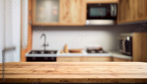 Empty of wood table top on on blurred kitchen counter background © ROKA Creative