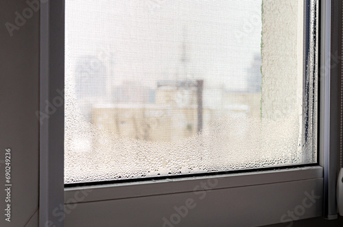 Drops of condensation in winter on the window