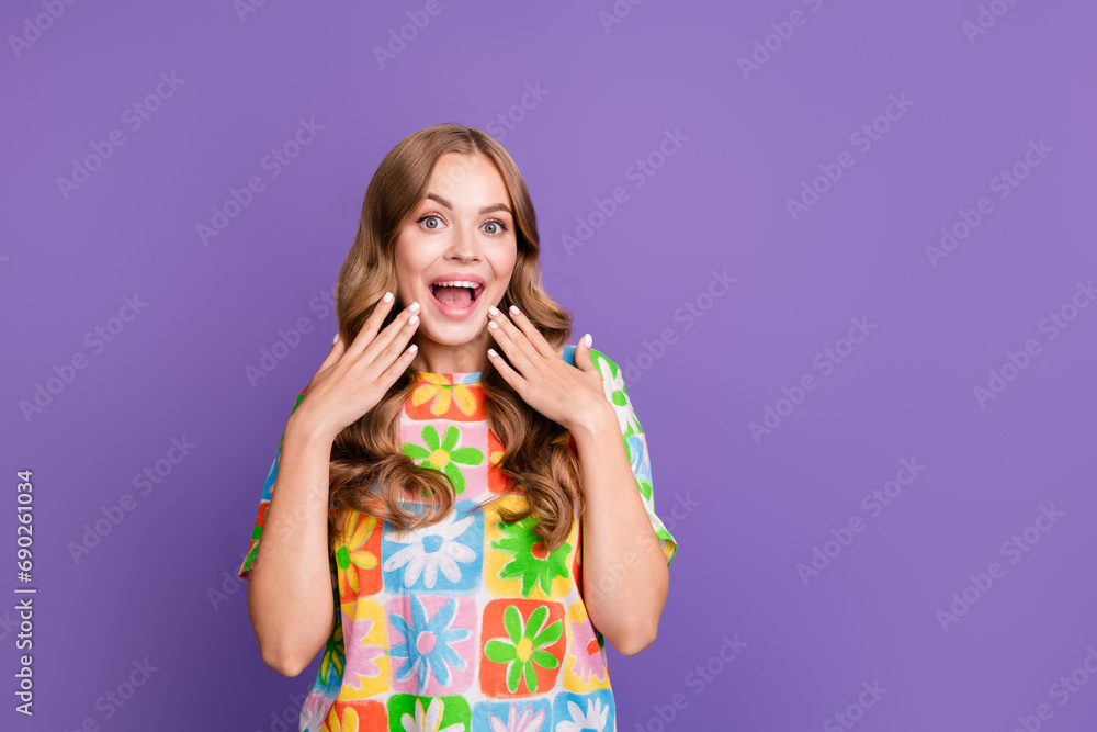 Portrait of young girl blonde touching cheeks crazy emotions at football match her boyfriend proposal isolated on purple color background Portrait of young girl blonde touching cheeks crazy emotions at football match her boyfriend proposal isolated on purple color background