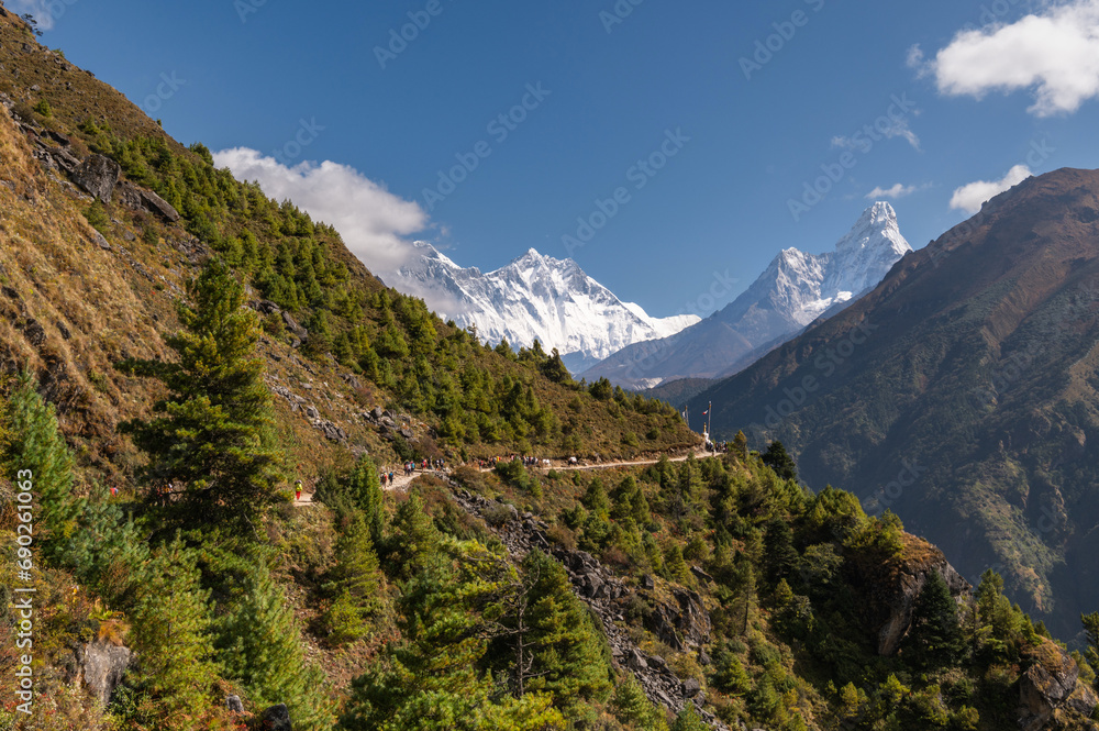 View of Nuptse, Everest, Lhotse and Ama Dablam mountains during trekking in Nepal in a clear day. EBC or Three passes trek in Nepal. Mountain range Himalayas in the Khumbu region of Nepal, Asia.