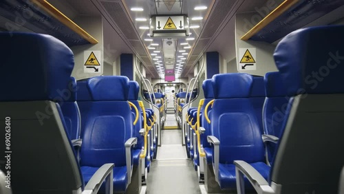 traveler walk pov in an empty modern high speed train driving on night route from Fiumicino airport to Termini railway stantion in Rome photo