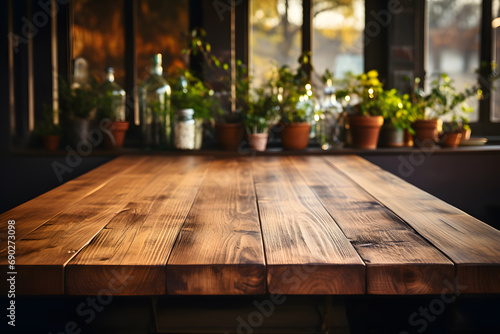 Empty wooden table with kitchen in background. 