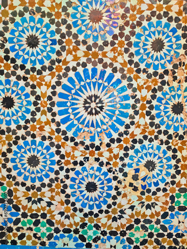 Islamic pattern of a mosaic in Moroccan style. Tiled oriental ornaments from Morocco are found in mosques and important buildings. © issam