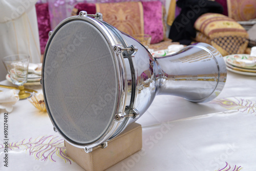 Arabic darbuka on a white table photo