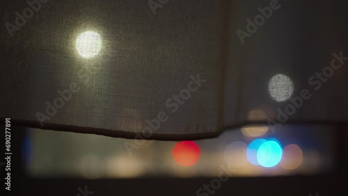 Out of focus police lights through the window photo