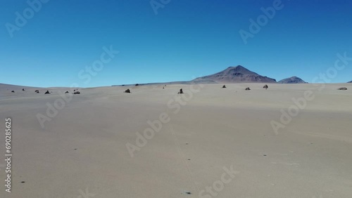 Camera approaching the rock formations of the Salvador Dali Desert in South Western Bolivia. photo