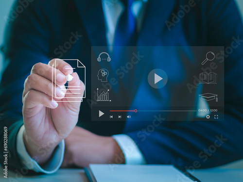e-learning concept Businessman touching virtual screen to stream online on virtual screen Watch videos on the internet Online seminar Education on the Internet