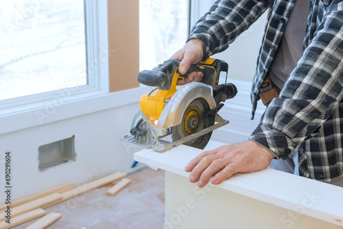 Manual circular saw must be used to cut interior doors to their required dimensions prior to installation photo