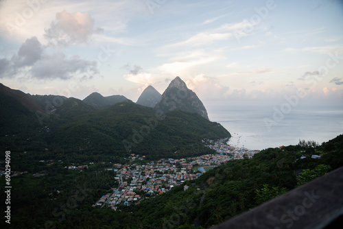 Aerial  top down view of the city of Soufriere with Pitons in the background.  Shot on a DJI Drone Air 2s in the Caribbean on beautiful Saint Lucia island.  Colorful houses throughout the town. photo