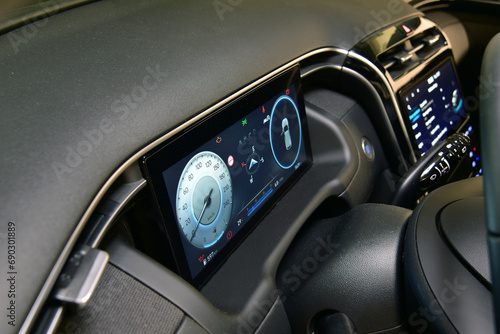 Digital instrument panel in a modern car © algre