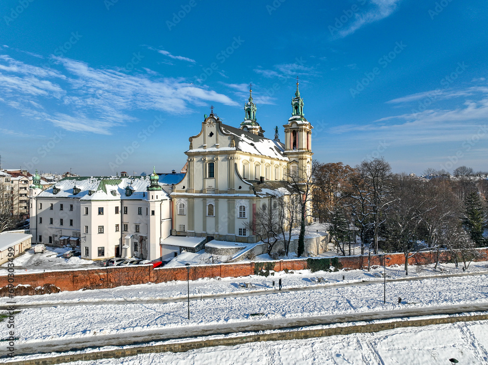 Skalka. St. Stanislaus church and Paulinite monastery in Krakow, Poland, in winter. Historic burial place of distinguished Poles. Aerial view with boulevard and promenade, surrounding wall and snow