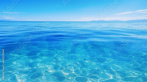 Tranquil Azure Waters: Clear Blue Sea Background with Calm Ripple Texture - Nature's Beauty for Summer Serenity and Underwater Peaceful Reflections.