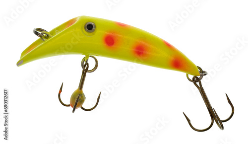 Macro image of a bright yellow fishing lure that has orange spots a silver / black “eye”. The lure has two treble hooks.  On a clean background.
 photo