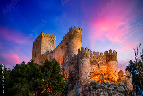 Spectacular view of the medieval castle of Almansa, Albacete, Spain, on a cliff at dawn photo