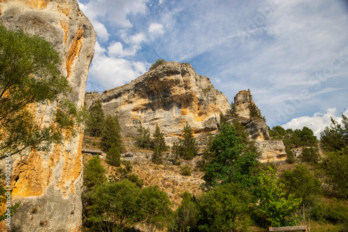 Rock formations of the Río Lobos Canyon with vultures flying in the sky is located in the west of the autonomous community of Castilla y León. © Chemari