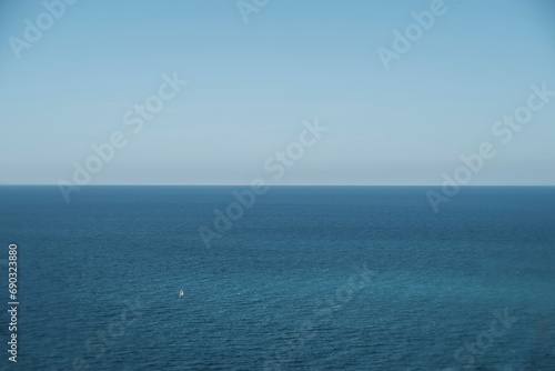 blue sea and sky and a lone boat
