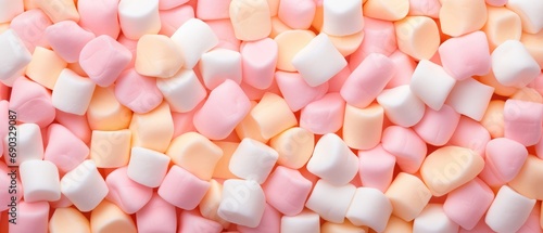 banch of marshmallow,peach pastel colors and pink  for candy shop banner, color of the year 2024 ,top view photo