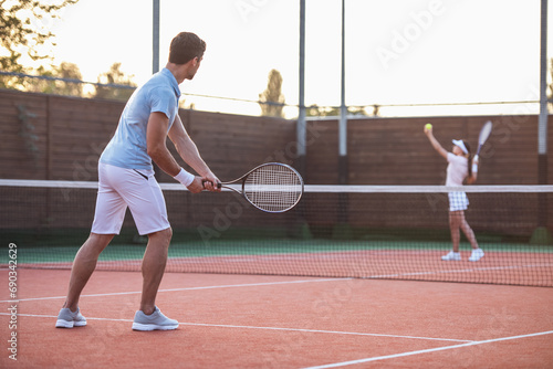 Couple playing tennis photo