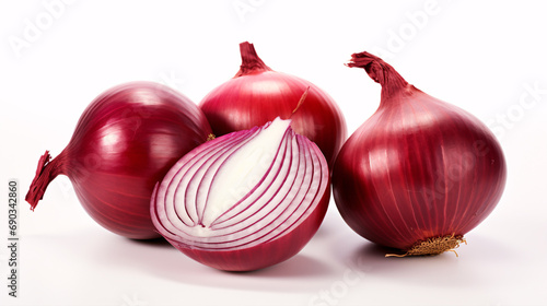 Isolated slices and bulb of onion on white surface.