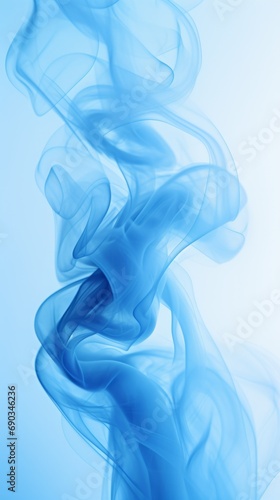 Whisps of blue smoke elegantly swirl against a pure white background photographed in slow motion—the harm of smoking. Dark ink spilled in the water. Presentation. Vertical banner