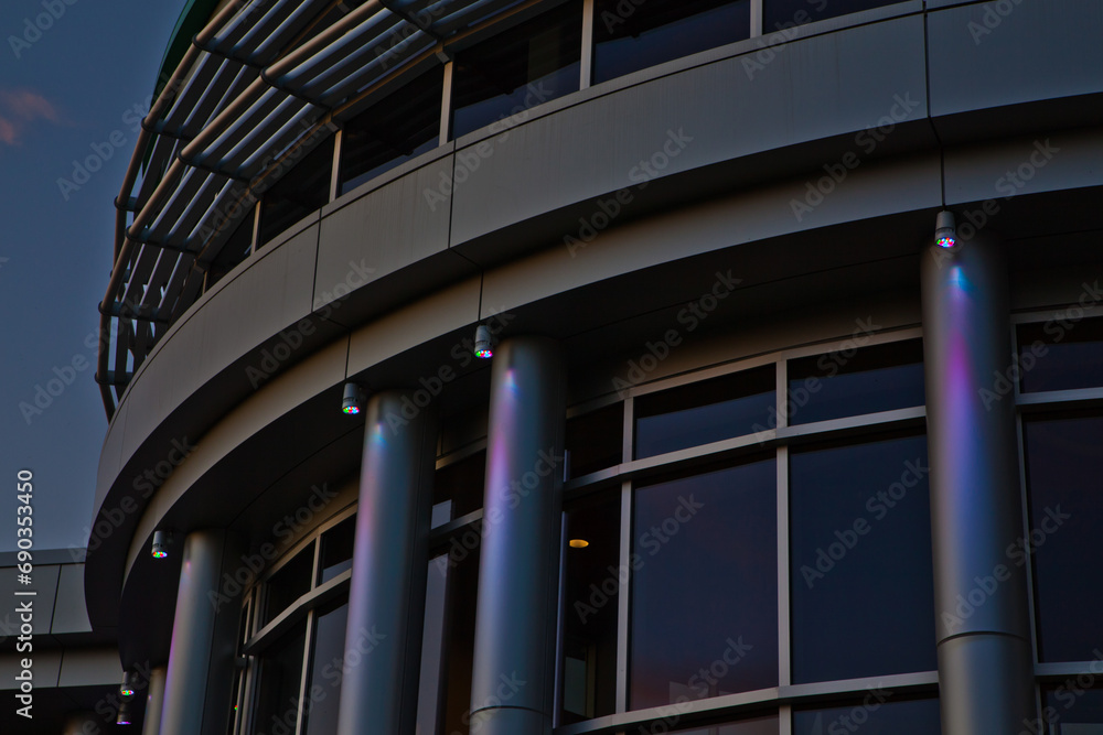 Fototapeta premium Detail of Modern Architectural Design at Dusk with Lights