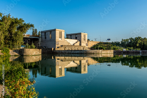 Volga river. Gateway of the Zhigulevskaya HPP dam. Samara Region. Russia. Quiet calm blue water early in the morning against a clear sky with a beautiful reflection. photo