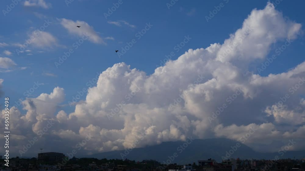 Few Small birds flying towards you from beautiful sky full of white clouds. Few Small birds flying towards you from beautiful sky full of white clouds.