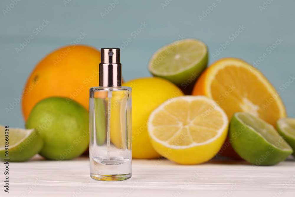 Perfume with citrus extracts. Selective focus. Spa day, concept of freshness perfume bottle with lemon lime and orange slices Perfume with citrus extracts. Selective focus. Spa day, concept of freshness perfume bottle with lemon lime and orange slices