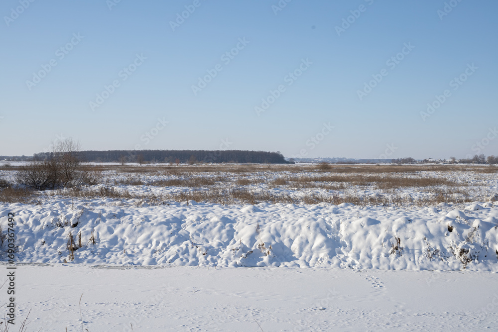 Snow-covered streets and fields on a sunny, frosty day