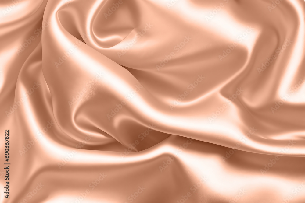 Abstract background, folds of silk fabric in peach fuzz color. Abstract background, folds of silk fabric in peach fuzz color.