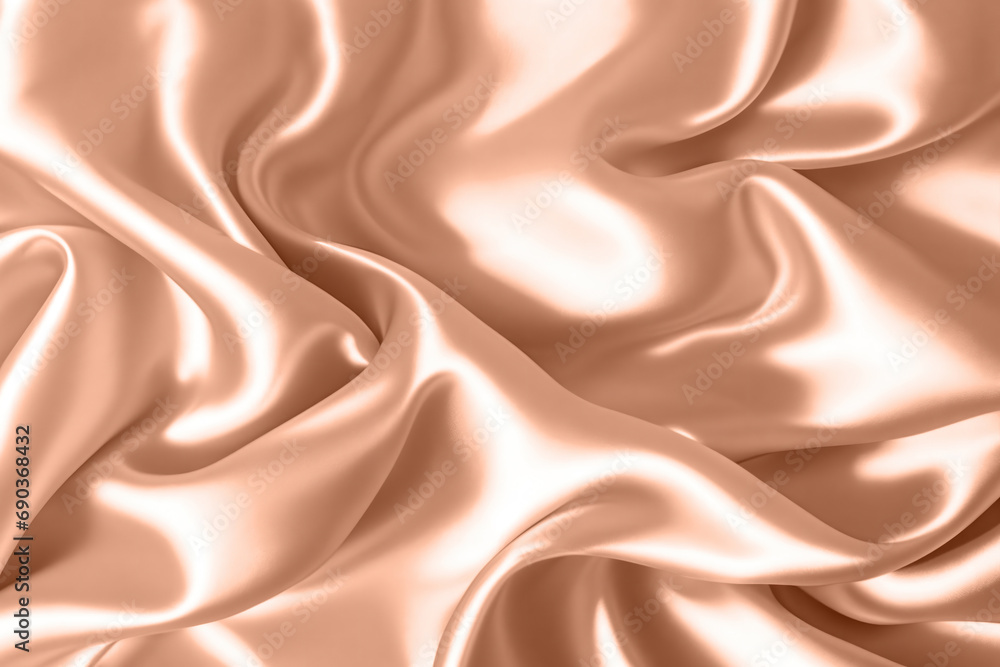 Fototapeta premium Abstract background, folds of silk fabric in peach fuzz color.