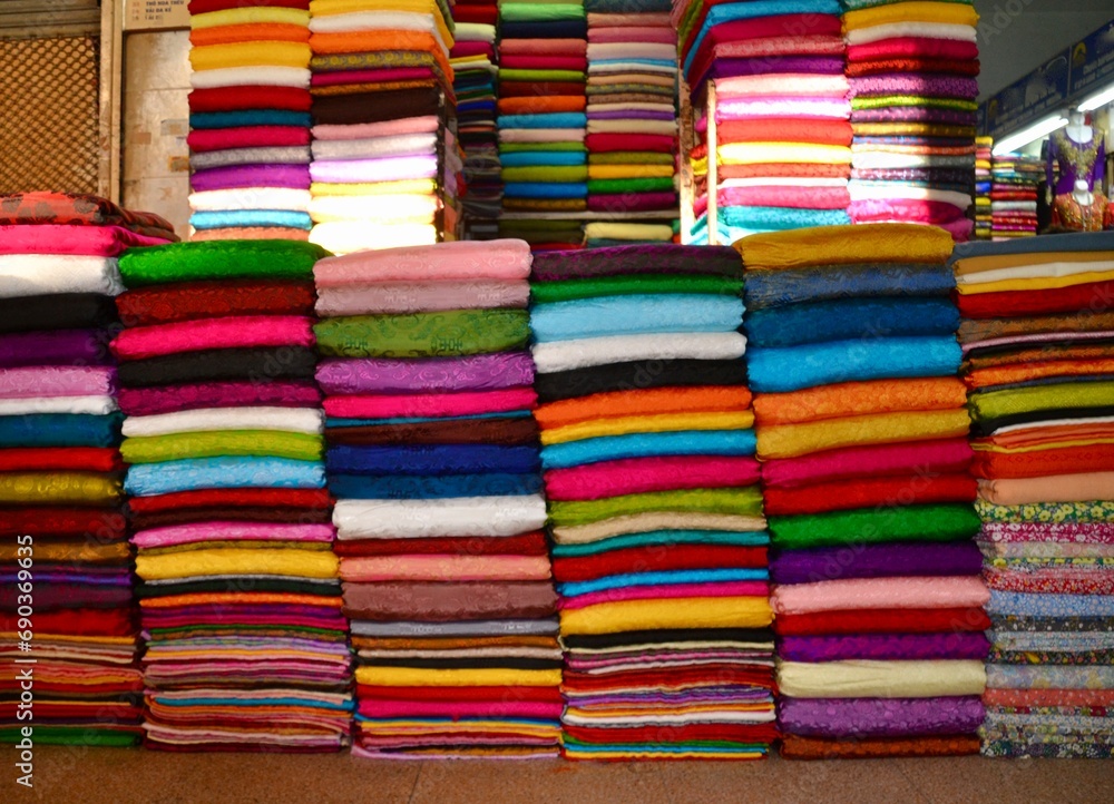 Piles or bolts of bright fabric in a Hanoi market Piles or bolts of bright fabric in a Hanoi market