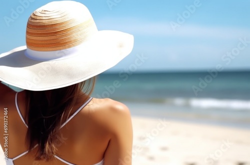 female model in hot on beach with white hat beach wear