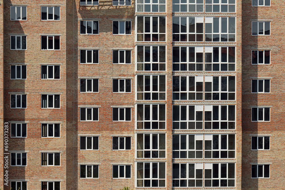 View of a large construction site with buildings under construction and multi-storey residential homes. Housing renovation concept