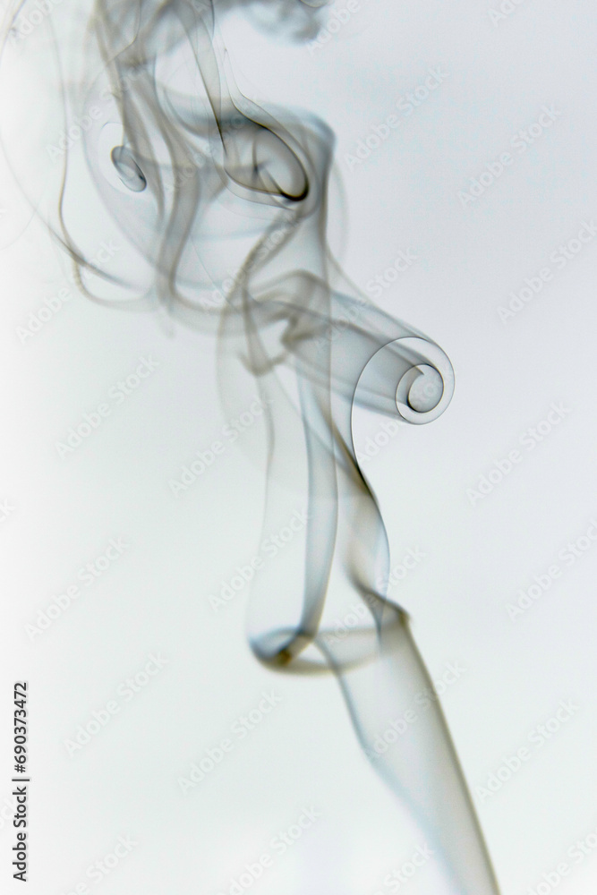 Abstract Incense Smoke Swirls in Soft Light and White Background