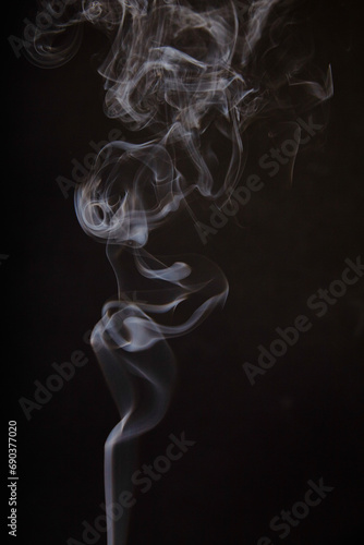 Ethereal Dance of Incense Smoke on Dark Background