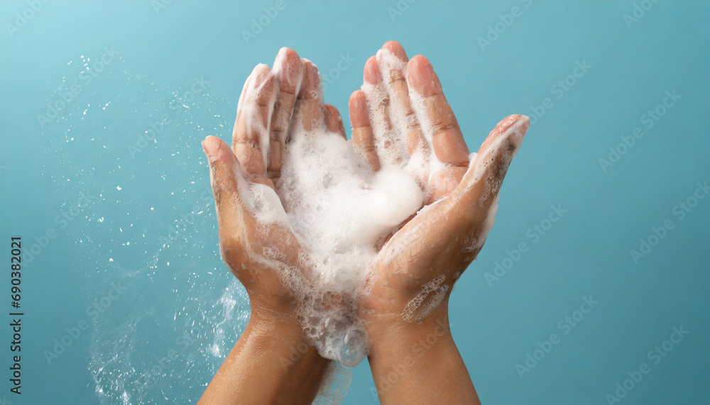 Woman hands in soap foam on light blue background. Woman hands in soap foam on light blue background.
