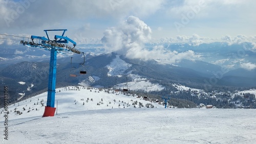 ski lift at the top of a snowy mountain. Ski resort