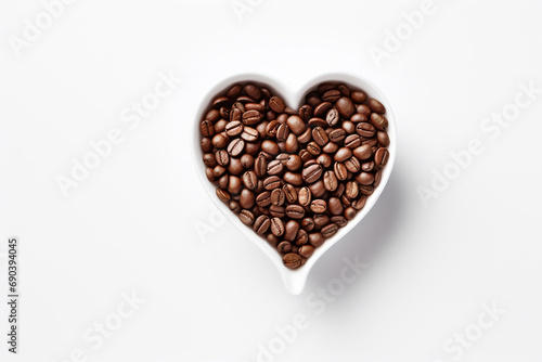 Concept of a cup of coffee in the shape of a heart standing on coffee beans. © Evgeniya Uvarova
