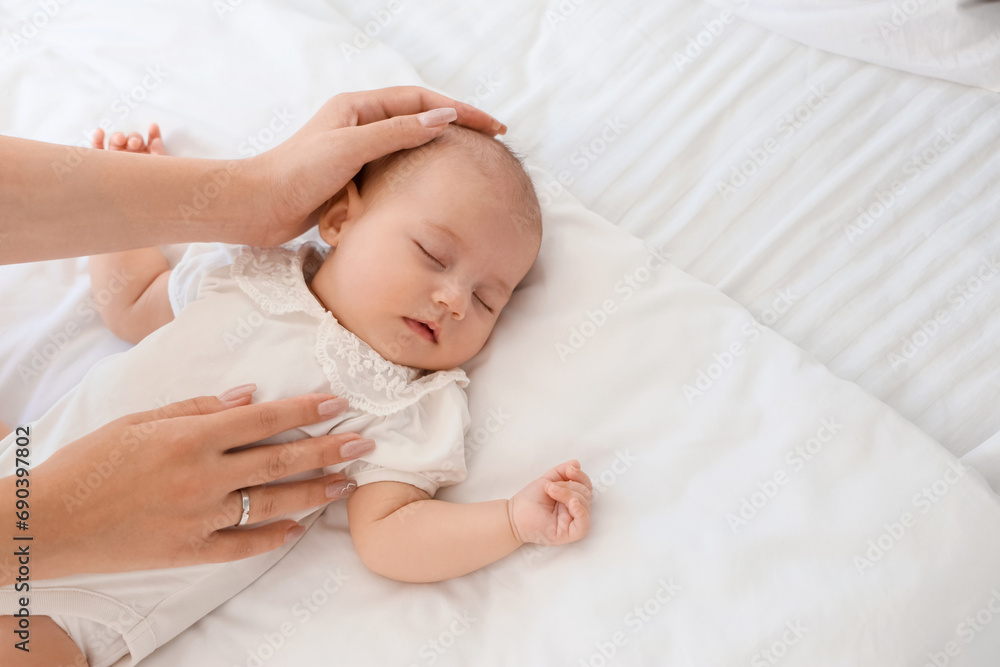 Mother with her little cute baby sleeping in bedroom at home Mother with her little cute baby sleeping in bedroom at home