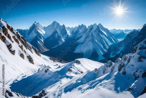 A spectacular view of a snowy mountain range under a clear blue sky, with rugged peaks and valleys