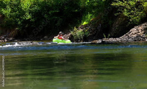 Gentle Rapid on Caddo River and Woman on Float