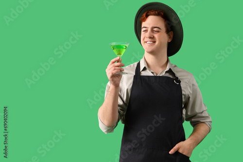 Young male bartender with g...