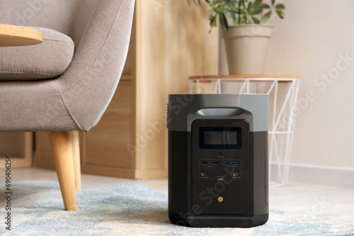 Portable power station on carpet in living room photo