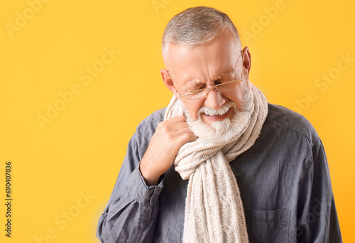 Sick mature man in scarf on...