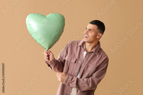 Happy young man with heart ...