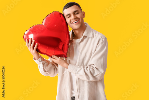 Young man with heart shaped...
