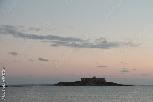 portopalo sicily italy small island in ocean water with building on it sunrise sunset morning evening dawn dusk twilight photo