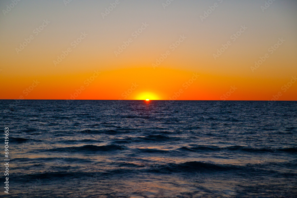 Golden Hour Tranquility: Sunset Over Lake Michigan