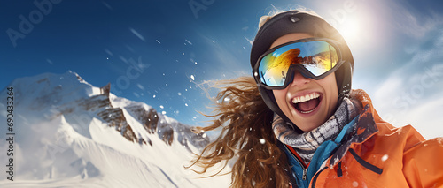 Ecstatic snowboarder in bright attire takes a selfie, her joy infectious against the stunning backdrop of snowy peaks.